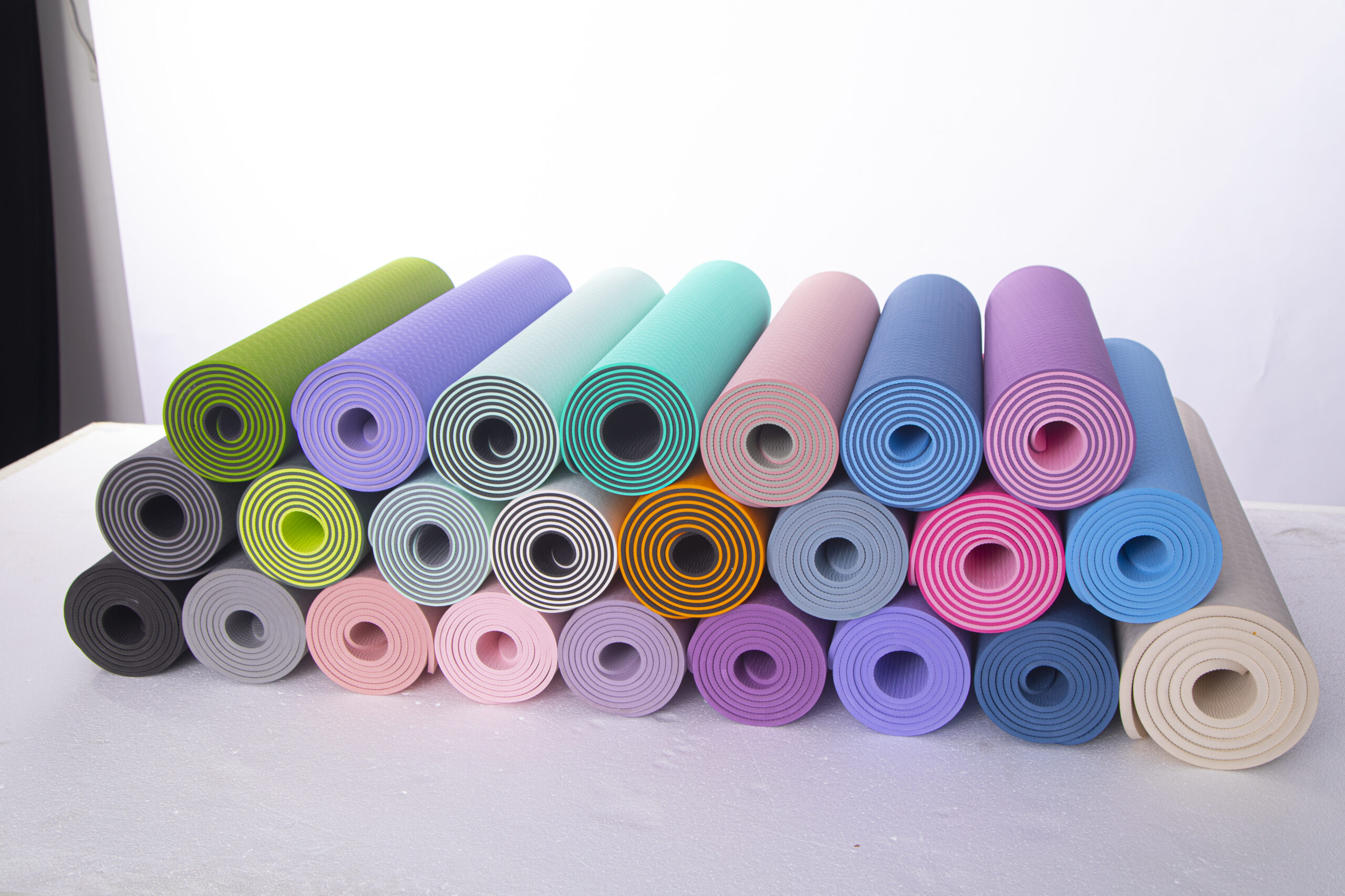 Color assortment of rolled yoga mats for custom orders for AICO Yoga OEM and private label programs.